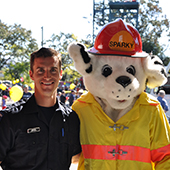 Firefighter with dog mascot