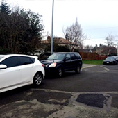 Vehicles parked at side of road