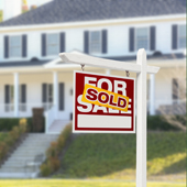 photo of for sale sign in front of house