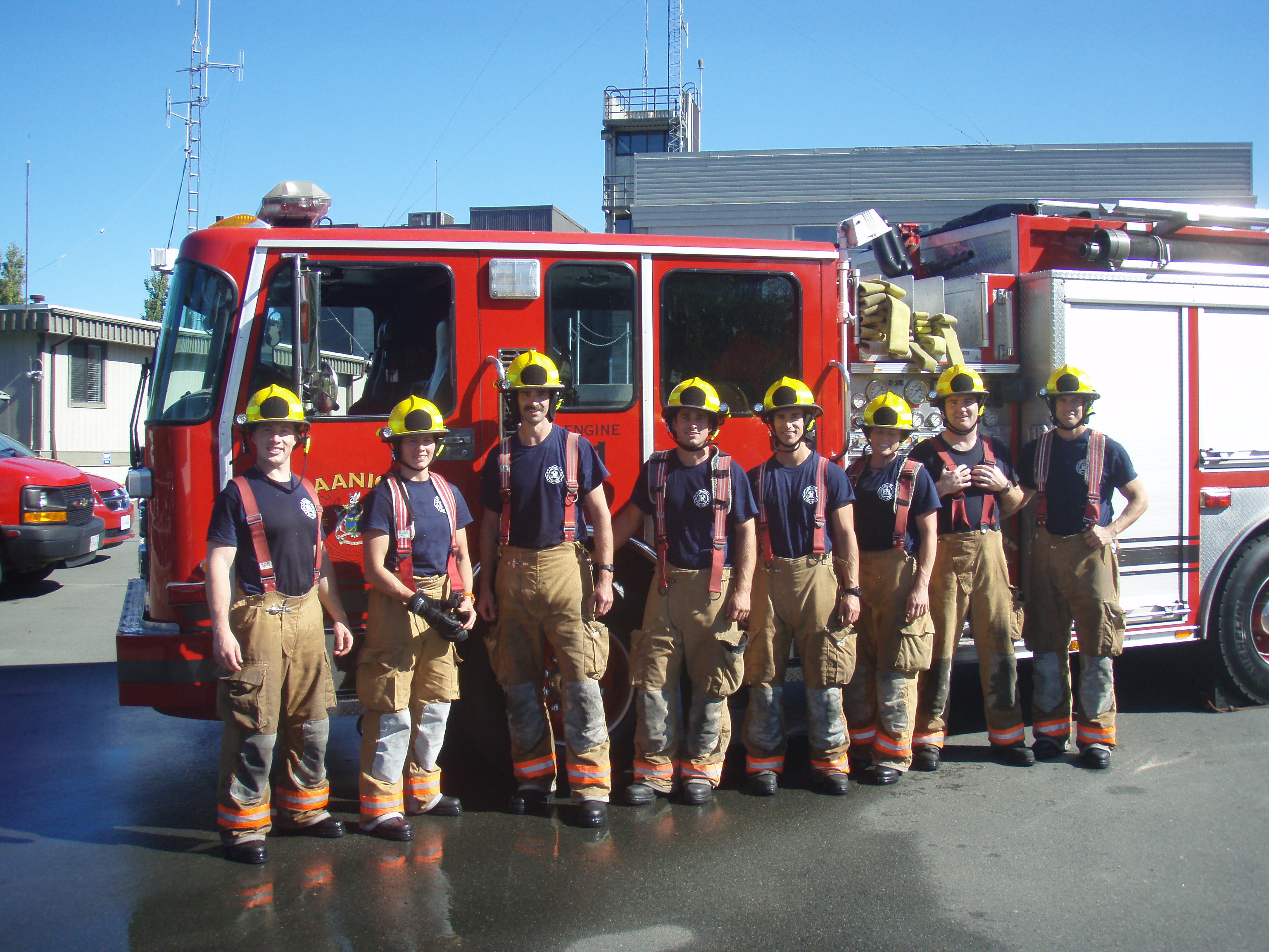 Firefighters in front of fire truck