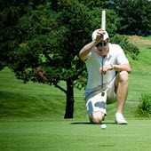 Image of golfer putting