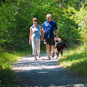 People walking along park trail