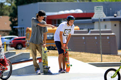 photo of boys with skateboards