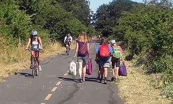 photo of walkers and bikers on trail